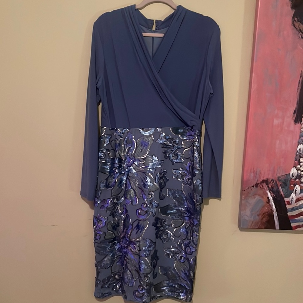 Beautiful dress in size US 14 . With embroidery at bottom of dress
